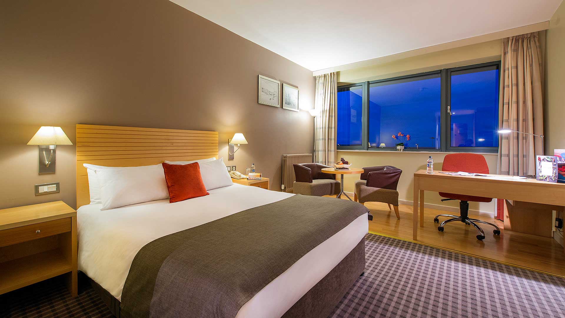 Nighttime shot of double bed in Cork International Airport hotel