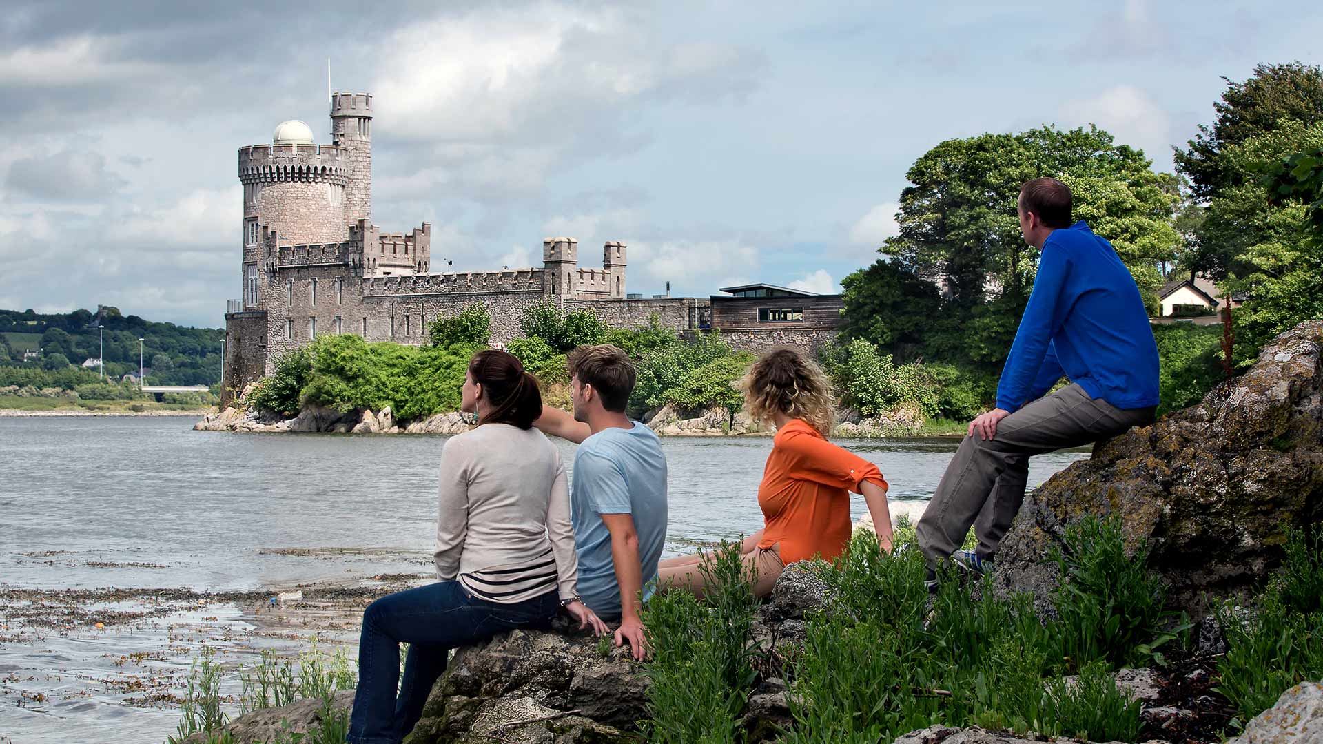 People sitting on the shore viewing Blackrock Castle Observatory