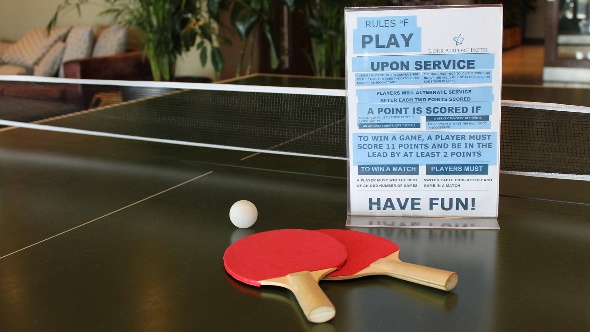Close up of ping pong table and list rules of play